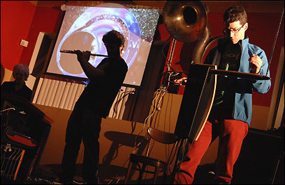 Jon Bernhardt (right, performing with the Lothars) plays the theremin for a new White Castle Commercial. (Wiqan Ang for the Boston Globe)